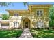 Stunning two-story home boasting a lush lawn, a brick pathway, and a terracotta roof at 1940 Floresta View Dr, Tampa, FL 33618
