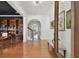 Bright foyer with gleaming hardwood floors and archways leading to the home's living spaces at 1940 Floresta View Dr, Tampa, FL 33618