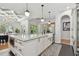 Spacious kitchen island with granite countertops, ample storage, and stylish pendant lighting at 1940 Floresta View Dr, Tampa, FL 33618