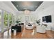 Bright and airy living room with hardwood floors, modern decor, and ample seating at 1940 Floresta View Dr, Tampa, FL 33618