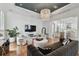 Spacious living room with hardwood floors, stylish furniture, and open floor plan at 1940 Floresta View Dr, Tampa, FL 33618