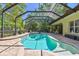 Screened-in pool with lounge chairs and patio area provides a perfect outdoor escape at 1940 Floresta View Dr, Tampa, FL 33618