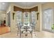 Charming breakfast nook with pool view, perfect for enjoying morning meals at 19830 Strathmore Pl, Land O Lakes, FL 34638