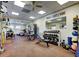 Well-equipped community gym features various machines, free weights, and mirrors for a comprehensive workout at 19830 Strathmore Pl, Land O Lakes, FL 34638