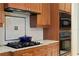 Granite countertops, updated appliances, and a decorative backsplash in the kitchen at 19830 Strathmore Pl, Land O Lakes, FL 34638