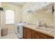 Bright laundry room featuring updated appliances, tile flooring and countertop space at 19830 Strathmore Pl, Land O Lakes, FL 34638