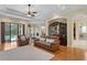 Spacious living area with hardwood floors, leather furniture, and stylish decor at 19830 Strathmore Pl, Land O Lakes, FL 34638