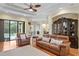 Inviting living area with hardwood floors, leather furniture, and stylish decor at 19830 Strathmore Pl, Land O Lakes, FL 34638