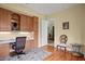 Functional office space with built-in storage and a view to the dining room at 19830 Strathmore Pl, Land O Lakes, FL 34638