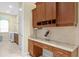 Office space with custom cabinetry and granite countertop, desk perfect for remote work at 19830 Strathmore Pl, Land O Lakes, FL 34638