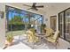 Relaxing screened patio with comfortable seating, ideal for outdoor enjoyment at 19830 Strathmore Pl, Land O Lakes, FL 34638