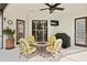 Covered patio with furniture, ceiling fan, and outdoor kitchen, perfect for relaxing or entertaining at 19830 Strathmore Pl, Land O Lakes, FL 34638