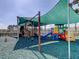 Community playground featuring a variety of play equipment and a shaded area for enjoyment at 19830 Strathmore Pl, Land O Lakes, FL 34638