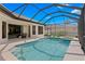 Inviting screened-in pool area with a jacuzzi and plenty of space for lounging at 19830 Strathmore Pl, Land O Lakes, FL 34638