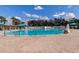 Community pool with clear blue water and ample seating, perfect for relaxation and recreation at 19830 Strathmore Pl, Land O Lakes, FL 34638
