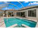 Backyard pool area with an enclosed pool and patio area great for entertaining guests at 19830 Strathmore Pl, Land O Lakes, FL 34638