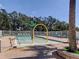 Community pool features a splash area, seating, and brick paver deck for relaxation and enjoyment at 19830 Strathmore Pl, Land O Lakes, FL 34638
