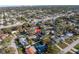 An aerial view highlighting the property's placement in a serene, tree-filled suburban neighborhood at 1990 59Th N St, St Petersburg, FL 33710