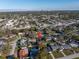 An aerial view of the home nestled in a peaceful neighborhood, with a glimpse of the city skyline at 1990 59Th N St, St Petersburg, FL 33710