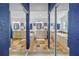 Symmetrical bathroom layout with double vanity, soaking tub, and a glass door shower reflected in mirrored closet doors at 1990 59Th N St, St Petersburg, FL 33710