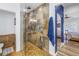 Bathroom with large stone shower, glass door, and adjacent toilet area near bedroom at 1990 59Th N St, St Petersburg, FL 33710