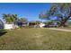 Quaint single-Gathering home with lovely lawn, landscaping, and a mature shade tree at 1990 59Th N St, St Petersburg, FL 33710