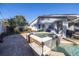 Beautiful backyard with a hot tub, stone patio, waterfall, and a nice view of the home at 1990 59Th N St, St Petersburg, FL 33710