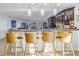 Kitchen with large island, granite countertops, modern pendant lighting, and bar seating at 1990 59Th N St, St Petersburg, FL 33710