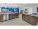 Well-equipped kitchen with stainless steel appliances, dark cabinetry, and a seamless flow into living spaces at 1990 59Th N St, St Petersburg, FL 33710