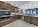 Modern kitchen with stainless steel appliances, dark cabinetry, and ample countertop space for cooking and entertaining at 1990 59Th N St, St Petersburg, FL 33710