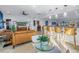 Open concept living room and kitchen with modern decor and bar seating at 1990 59Th N St, St Petersburg, FL 33710