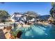 Backyard pool with solar and a spa surrounded by lush plants and a paver patio at 1990 59Th N St, St Petersburg, FL 33710