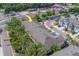 A residential street shows attractive townhomes, convenient access to a main thoroughfare and ample parking at 2013 Sunset Wind Loop, Oldsmar, FL 34677