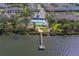Community aerial view highlighting a pool, clubhouse, and private dock on the water at 2013 Sunset Wind Loop, Oldsmar, FL 34677