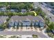 Aerial view of a multi-unit residential complex with a well-maintained facade and manicured landscaping at 2013 Sunset Wind Loop, Oldsmar, FL 34677