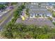 A desirable townhome community showcases well-maintained exteriors and convenient access to nearby roadways and waterfront views at 2013 Sunset Wind Loop, Oldsmar, FL 34677