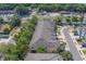A desirable townhome community showcases well-maintained exteriors and convenient access to nearby roadways and waterfront views at 2013 Sunset Wind Loop, Oldsmar, FL 34677