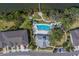 Aerial view showcases the pool, clubhouse, and dock at 2013 Sunset Wind Loop, Oldsmar, FL 34677