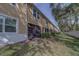 Enclosed patio of townhome showing screened in lanai with a privacy hedge at 2013 Sunset Wind Loop, Oldsmar, FL 34677