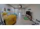 Recreational room with unique decor, including fun seating, a surfboard, and a mounted television at 2013 Sunset Wind Loop, Oldsmar, FL 34677