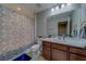 This bathroom features a combination shower and tub, toilet, and modern vanity at 2013 Sunset Wind Loop, Oldsmar, FL 34677