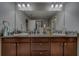 This spacious bathroom features double sinks, granite counters, and modern fixtures at 2013 Sunset Wind Loop, Oldsmar, FL 34677