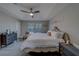 This bedroom features a tray ceiling, lots of natural light and elegant furnishings at 2013 Sunset Wind Loop, Oldsmar, FL 34677
