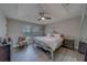 This bedroom features a tray ceiling, lots of natural light and elegant furnishings at 2013 Sunset Wind Loop, Oldsmar, FL 34677