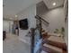 Inviting staircase that opens up to a modern kitchen, creating a bright and welcoming atmosphere at 2013 Sunset Wind Loop, Oldsmar, FL 34677