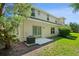 Spacious backyard with lush green grass and mature trees, perfect for outdoor activities and relaxation at 20221 Vintage Oaks Pl, Tampa, FL 33647
