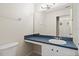 Bathroom featuring a vanity with a white sink and a blue countertop at 20221 Vintage Oaks Pl, Tampa, FL 33647