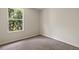 Bedroom featuring carpet and a window with view at 20221 Vintage Oaks Pl, Tampa, FL 33647