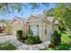 Lovely single-Gathering home featuring a two-car garage, neutral exterior paint, and lush landscaping at 20221 Vintage Oaks Pl, Tampa, FL 33647