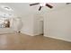 Bright living room with tile flooring offering seamless transition to the kitchen and staircase access at 20221 Vintage Oaks Pl, Tampa, FL 33647
